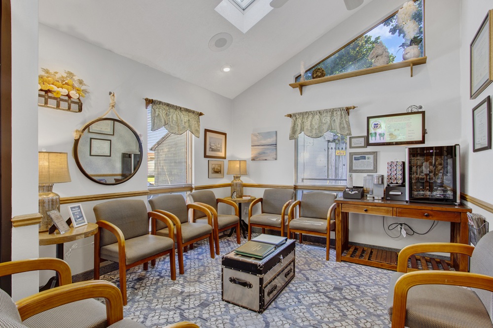 Comfortable dental office waiting room with seating and welcoming décor