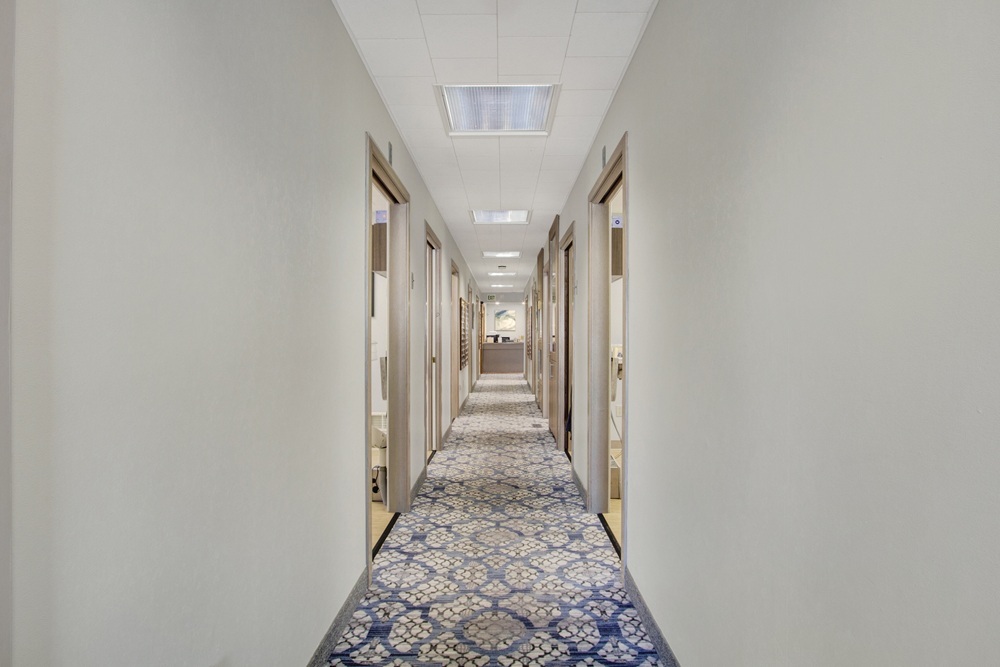 Hallway connecting treatment rooms throughout the dental office