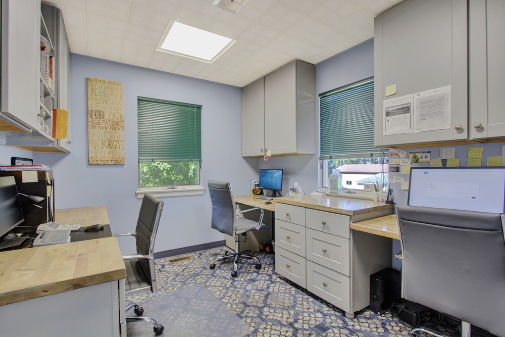 Dental laboratory and sterilization area with workstations and cabinetry