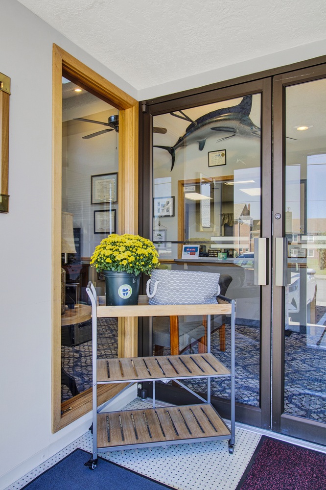 Welcoming entrance to the dental office with accessible doorway and reception area